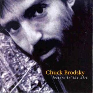 Close-up portrait of Chuck Brodsky with album title text overlayed.