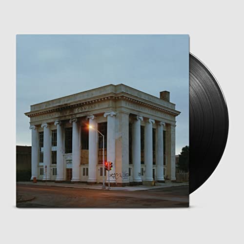 Vinyl record cover featuring a faded, neoclassical building exterior.