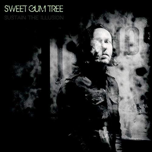 Black and white album cover featuring a blurred portrait of a man.