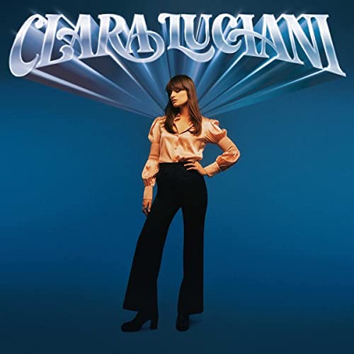 Clara Luciani album cover: portrait of a woman in pink and black.