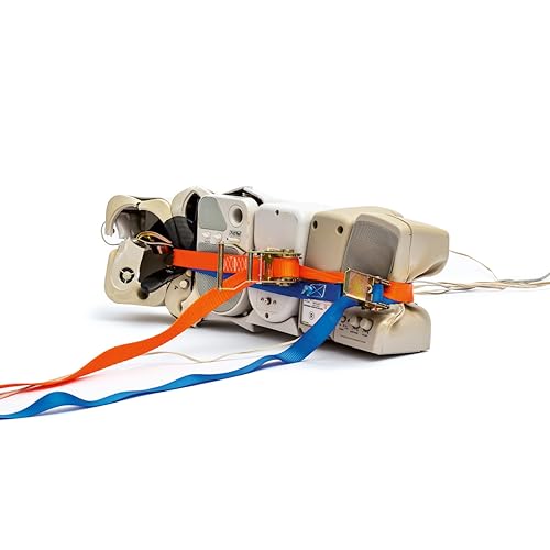 Stacked vintage tape players secured with orange and blue straps.