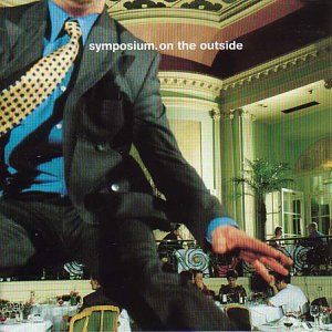 CD cover: a large man in a suit looms over a restaurant scene.