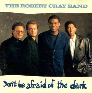 Robert Cray Band album cover, four men in suits, dark background.