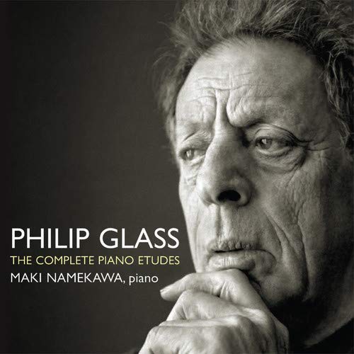 Close-up portrait of Philip Glass with album title text overlayed.
