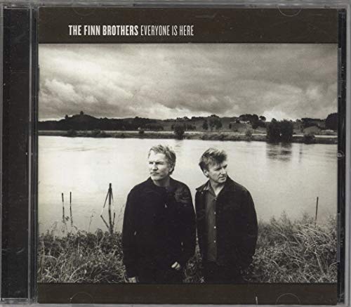 CD case featuring two men against a cloudy, rural landscape.