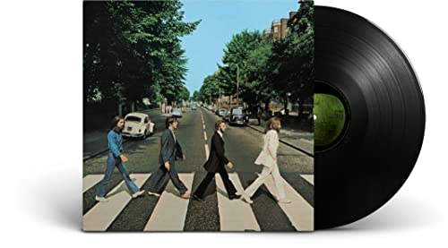 The Beatles’ Abbey Road album cover with a vinyl record.