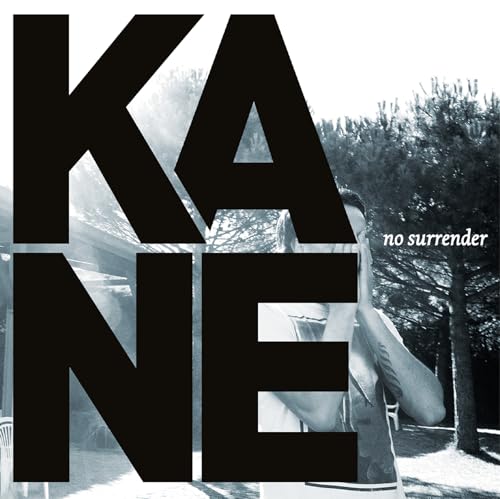 Album cover for Kane’s “No Surrender” with large text and a blurred figure.
