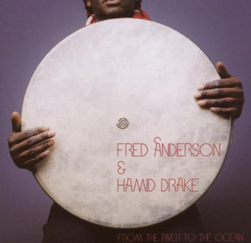 CD cover: a person holding a large, round frame drum.