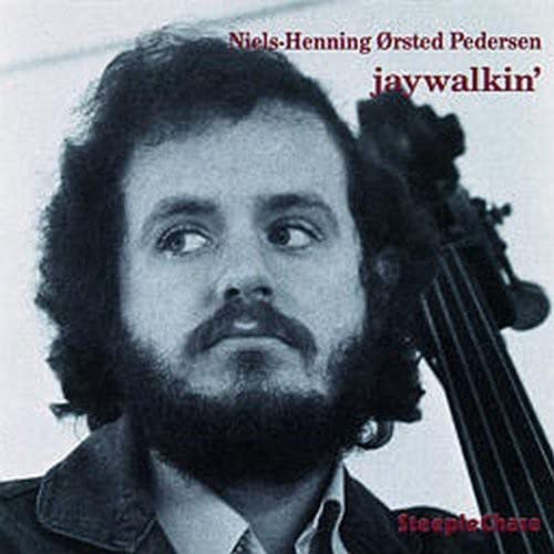 Close-up of bassist Niels-Henning Ørsted Pedersen with his instrument.