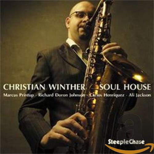 Christian Winther holding a saxophone on the “Soul House” CD cover.