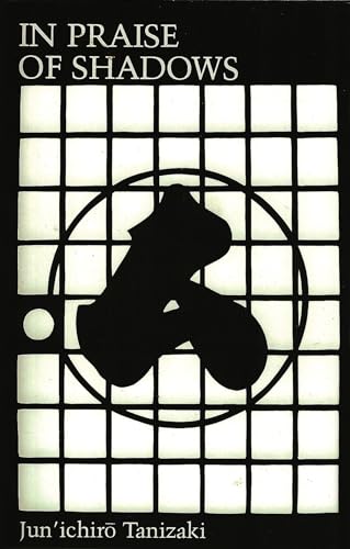 Book cover with white grid, black circle, and abstract silhouette on a black background.