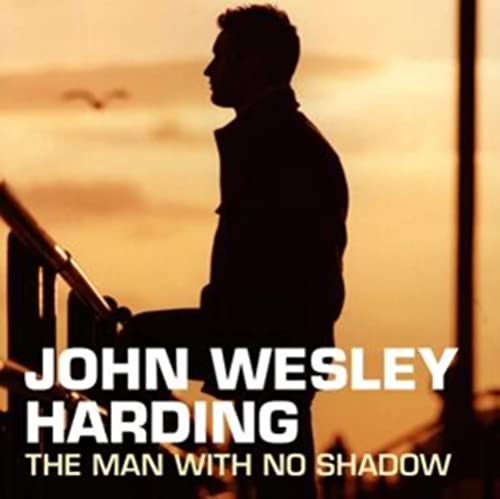 Silhouetted man against a warm sunset, album cover for John Wesley Harding.