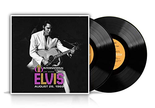 Vinyl record album cover featuring Elvis Presley playing guitar with two black vinyl discs.