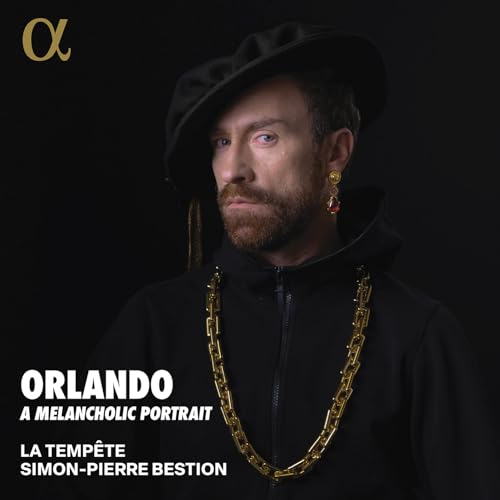 Man in a dark hat and gold chain, album cover for “Orlando”.