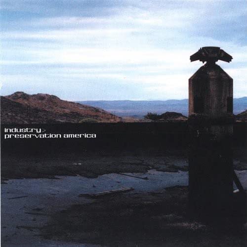 CD cover: desolate landscape with a weathered gas pump in foreground.