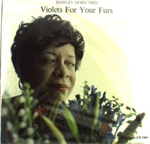 Shirley Horn portrait on album cover with flowers in foreground.