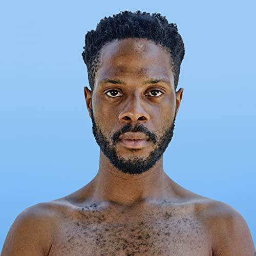 Close-up portrait of Fat Tony, a Black man with short hair and beard.