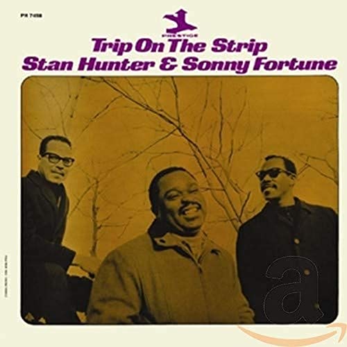Album cover featuring three men in suits with the title "Trip On The Strip".