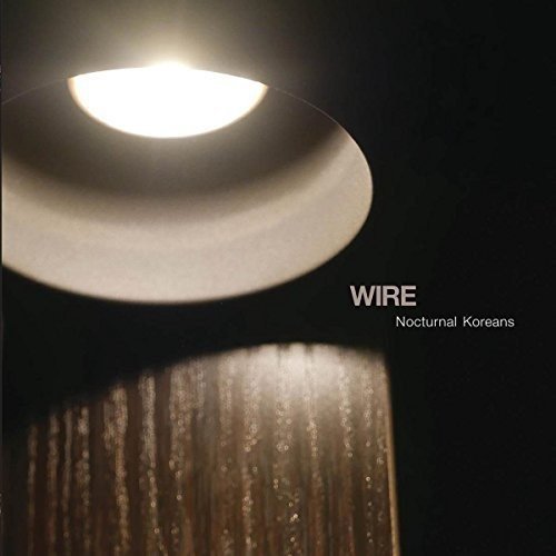Wire album cover, "Nocturnal Koreans", featuring a bright light and text.
