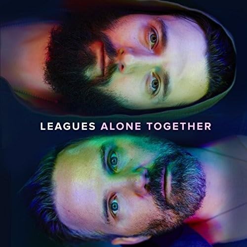 CD cover: two mirrored portraits of a bearded man with colorful lighting.