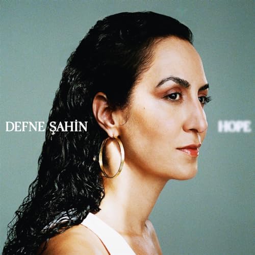Defne Şahin album cover: portrait of a woman with curly hair.