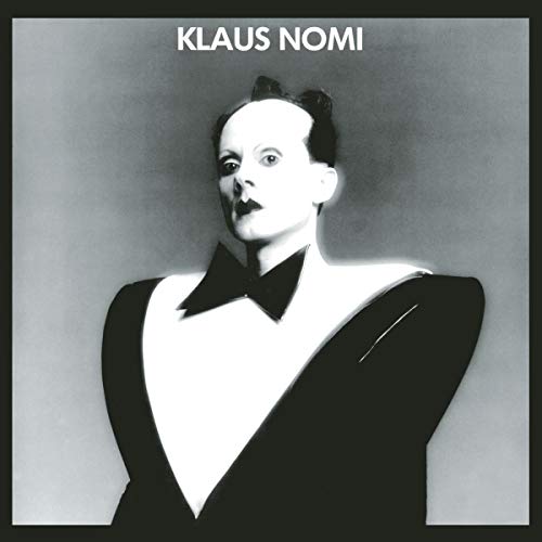 Black and white portrait of Klaus Nomi in formal wear.