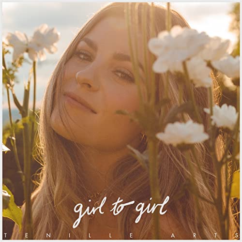 Album cover for Tenille Arts’ “Girl To Girl” featuring a woman and flowers.