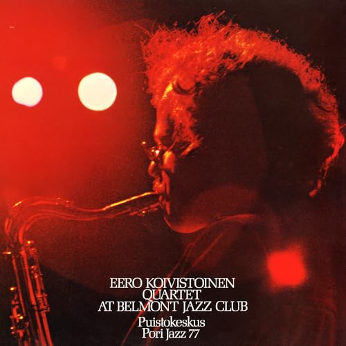 Saxophonist Eero Koivistoinen in red lighting, album cover for “At Belmont Jazz Club.”