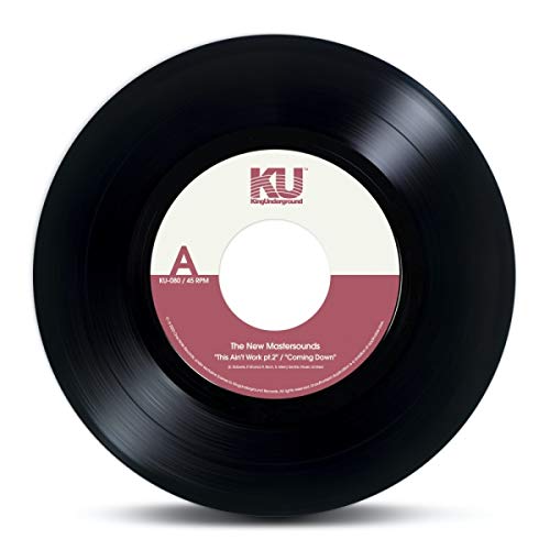 Black vinyl record with a red and white label, displaying "The New Mastersounds.