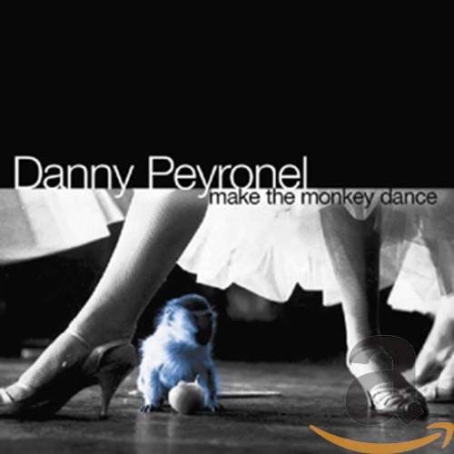 CD cover: dancers' legs with a small monkey at their feet.