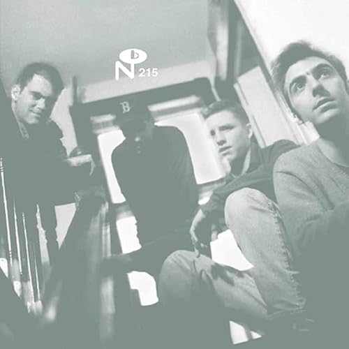 Black and white album cover featuring four young men looking downwards.