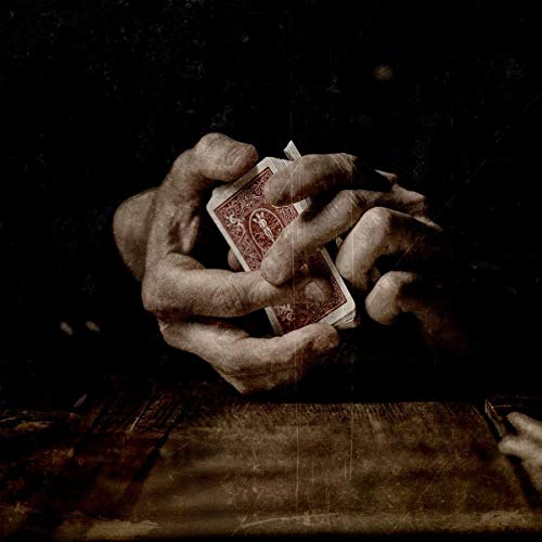 Dark, textured image of a hand gripping a red and white playing card.