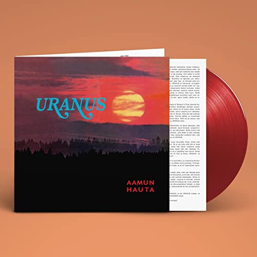 Vinyl record with red disc and cover depicting a sunset landscape.