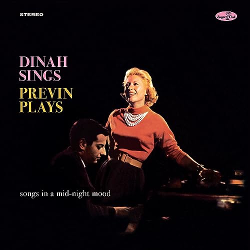 Dinah Shore and André Previn on album cover, dark background.