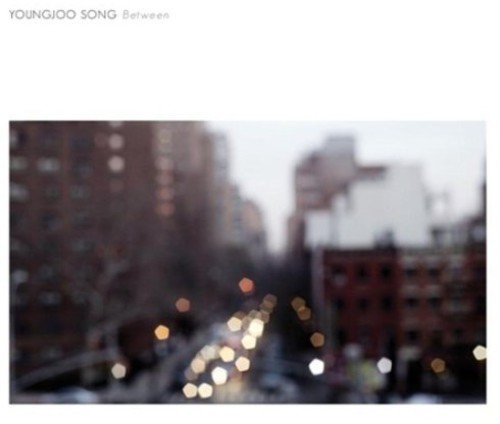 CD cover with blurred cityscape and artist name "Youngjoo Song".