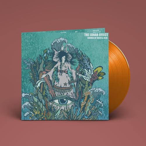 Vinyl record and album cover featuring a woman amidst lush foliage.