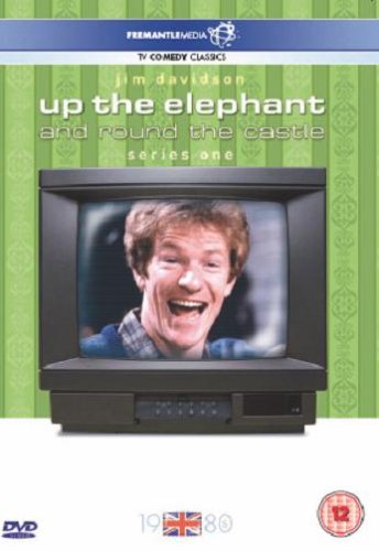 Man laughing on old TV set against green wallpaper with patterned border.
