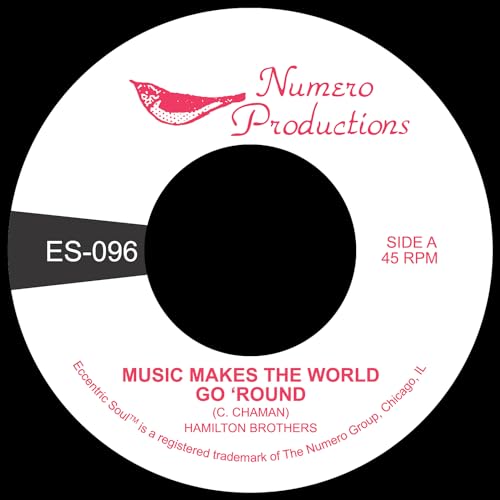 Red and white vinyl record label with black center hole and text.