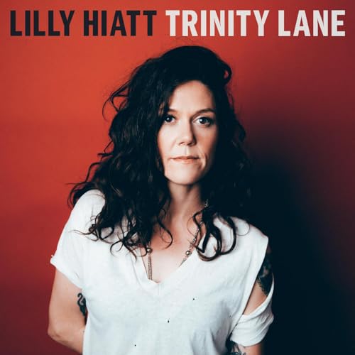 Lilly Hiatt album cover, portrait of a woman with dark curly hair.