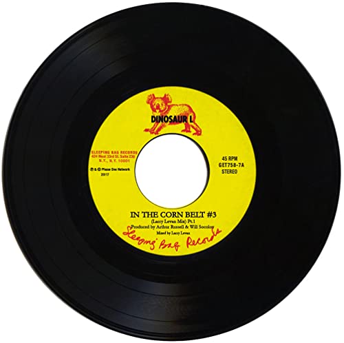 Black vinyl record with yellow label featuring a red dinosaur illustration.