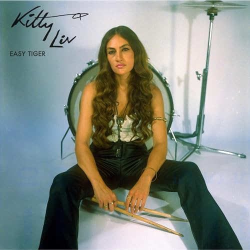 Album cover for Kitty Liv’s “Easy Tiger” featuring a woman with long hair.