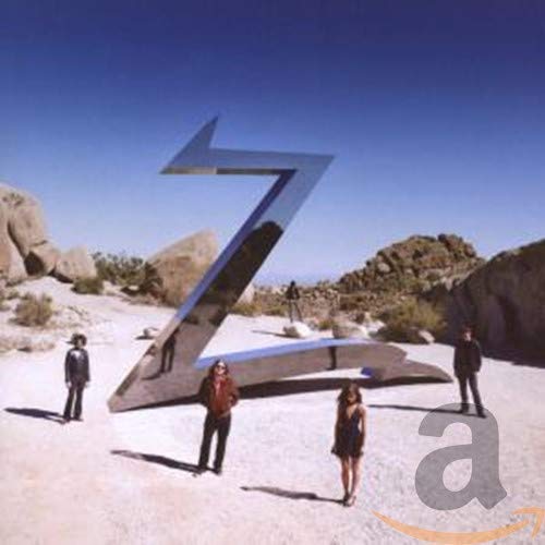 The Zutons album cover featuring band members near a large, angled "Z".
