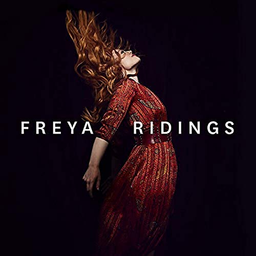 Freya Ridings album cover featuring a woman with flowing red hair.