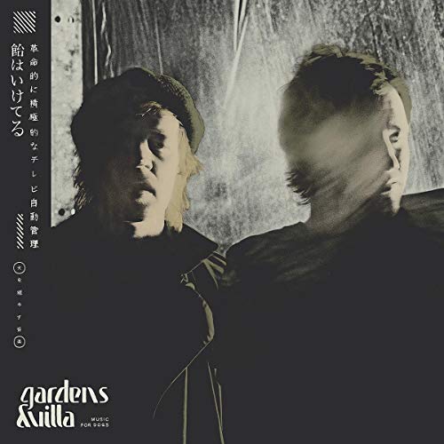 Album cover featuring two men in shadow with Japanese text.