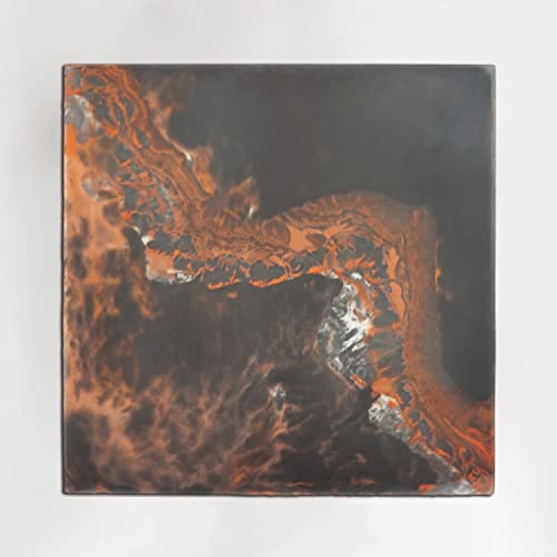 CD case with abstract orange and black swirling paint design.
