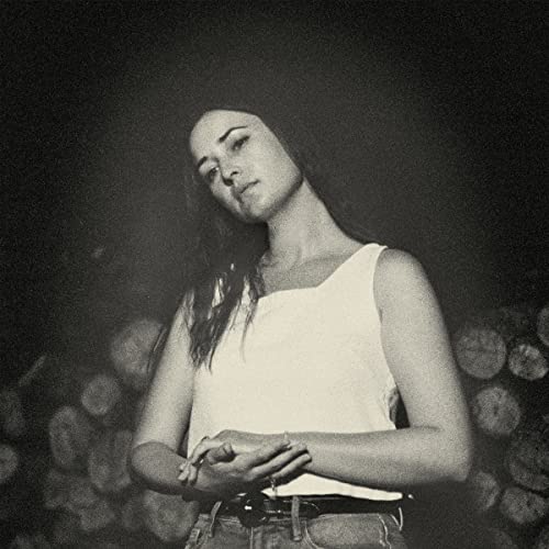 Black and white portrait of Jess Williamson, looking upwards.