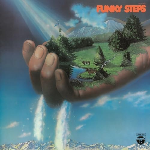 Album cover: hand holding a landscape with cows and mountains.