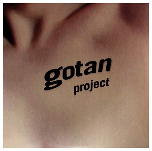 Close-up of skin with the text “gotan project” in black.