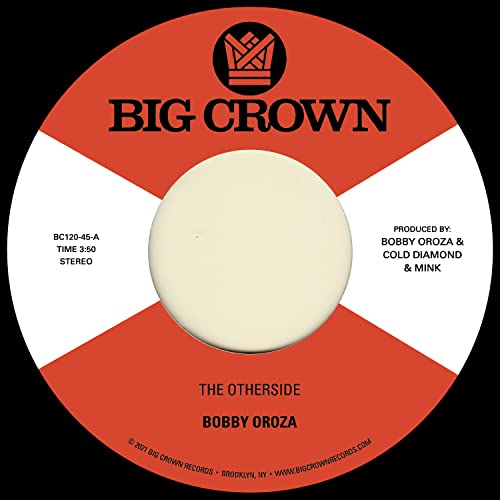 Red and white vinyl record label with black text and central hole.