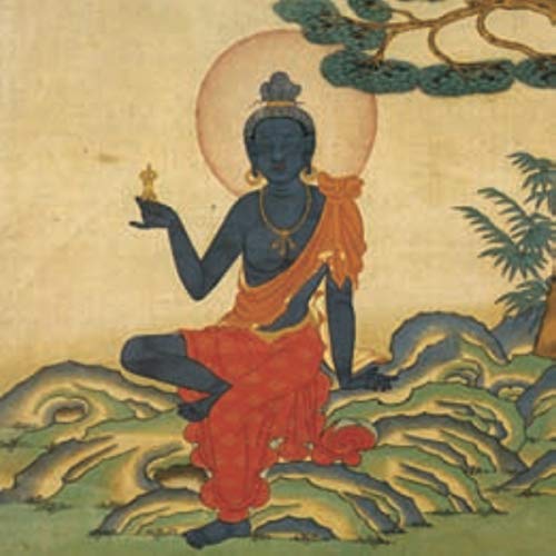Blue Buddha seated in lotus position with orange and red robes.